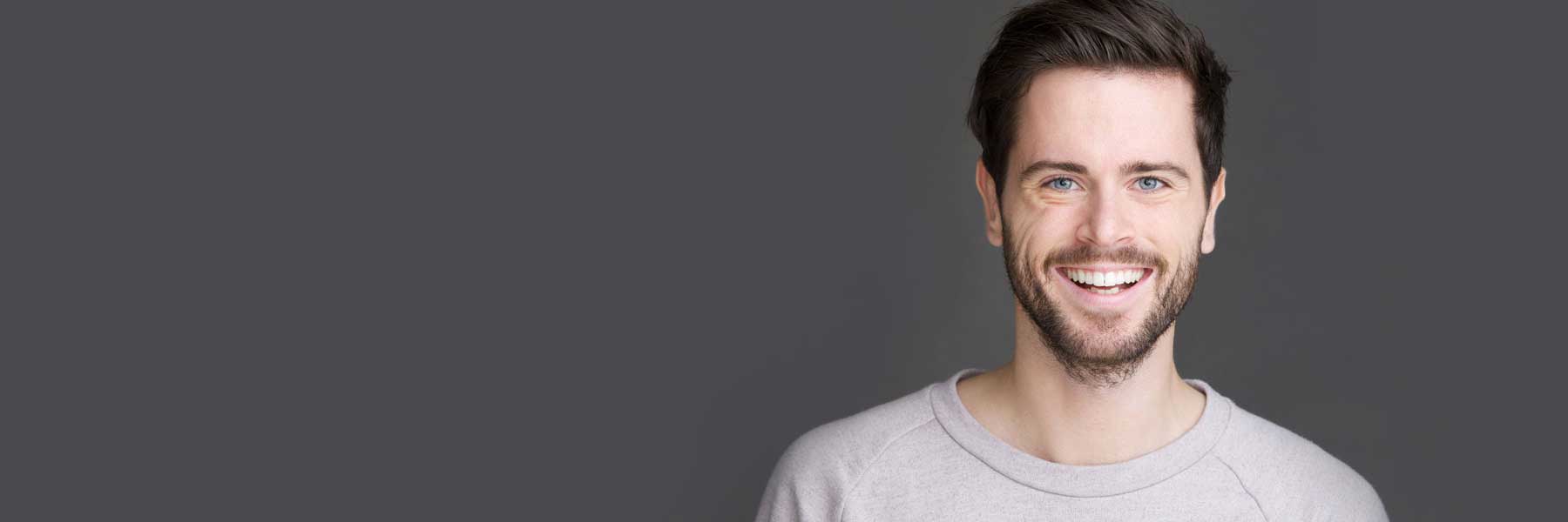 Healthy adults smiling with no pain