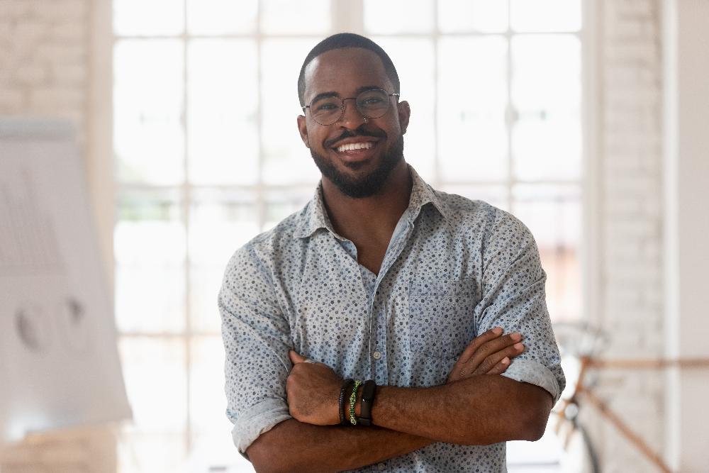 man with glasses smiling | dentist near me