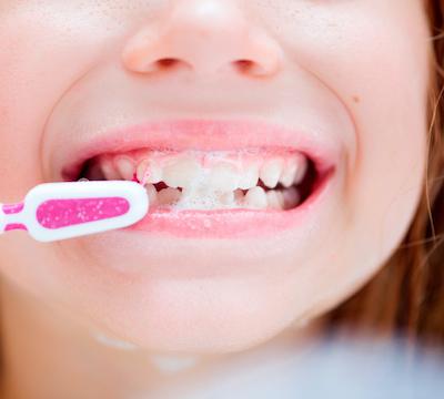 patient brushing teeth | children's dentist winston salem nc