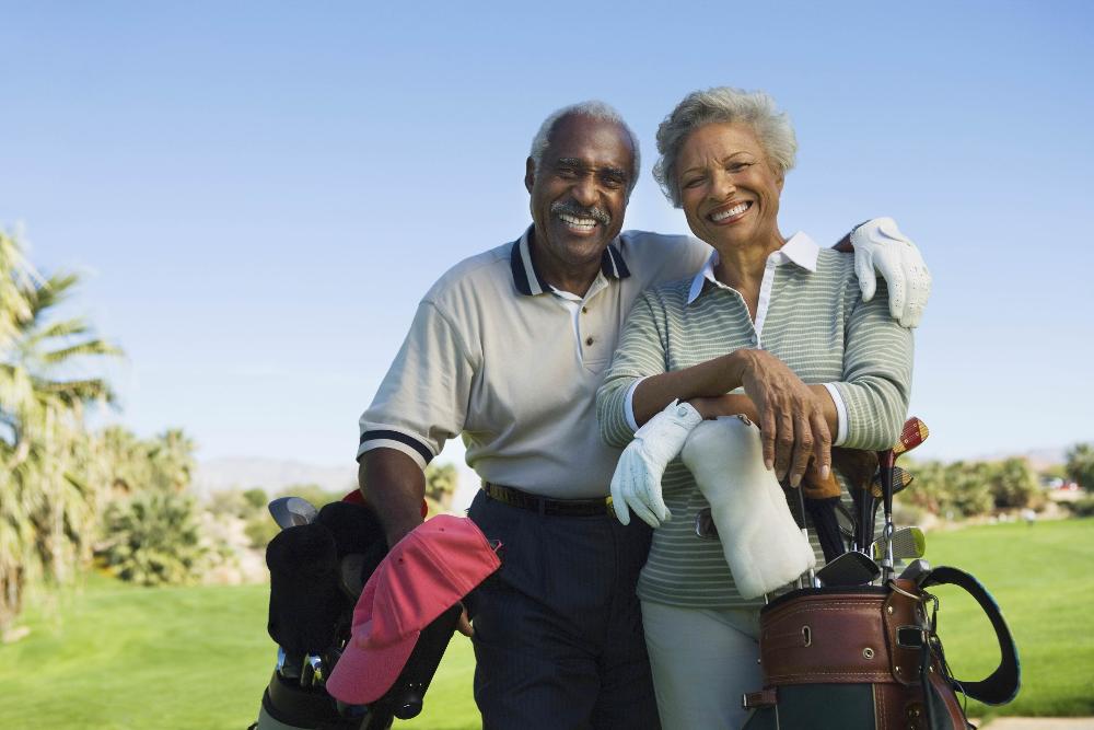 older couple smiling outside | dental crowns winston salem nc