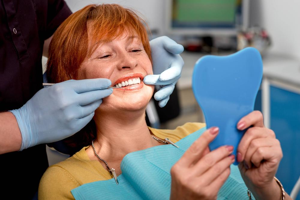 woman smiling with dentures | winston salem dentist
