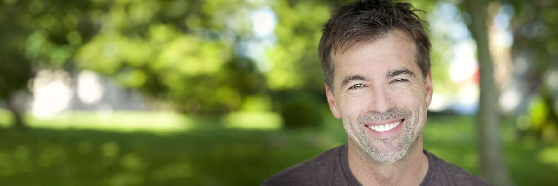 Middle aged man smiling after going to the dentist, winston-salem nc