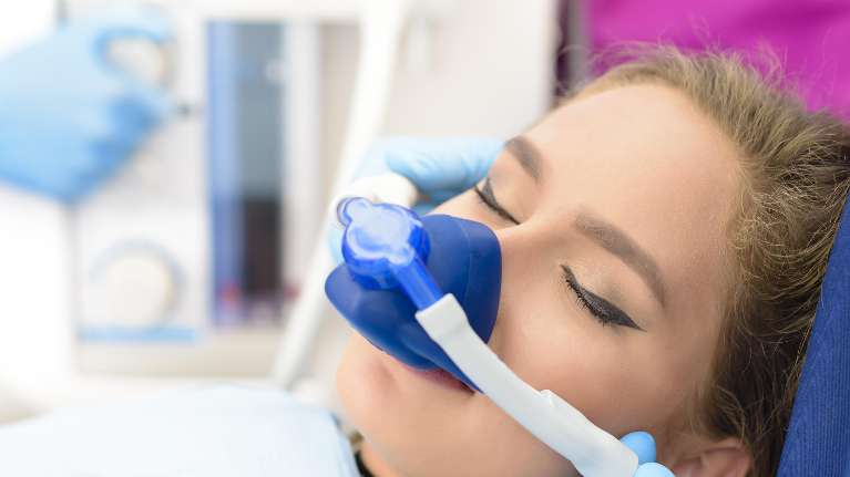woman utilizing sedation dentistry | sedation dentistry winston salem nc