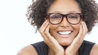 woman with reading glasses | dentures winston salem nc