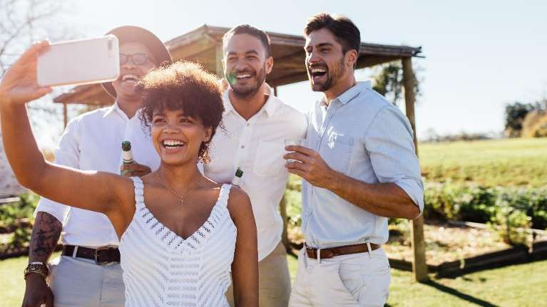 People smiling together taking a selfie at a winery, winston salem nc