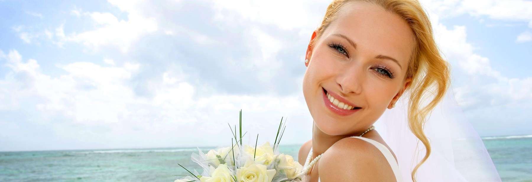 Bride in wedding dress smiling after veneers, winston-salem nc