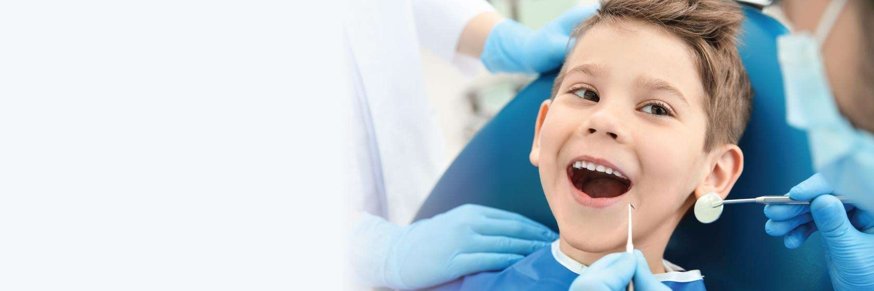 Young boy in dentist chair with mouth open, winston-salem nc