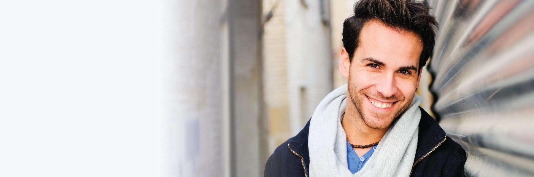 man smiling outside | dental implants winston salem nc