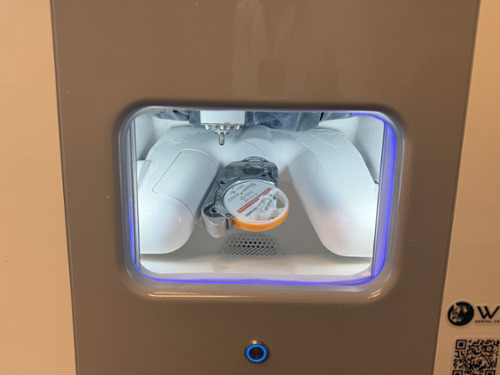 Redon Hybrid 5-axis dental milling machine milling a zirconia crown restoration in-office